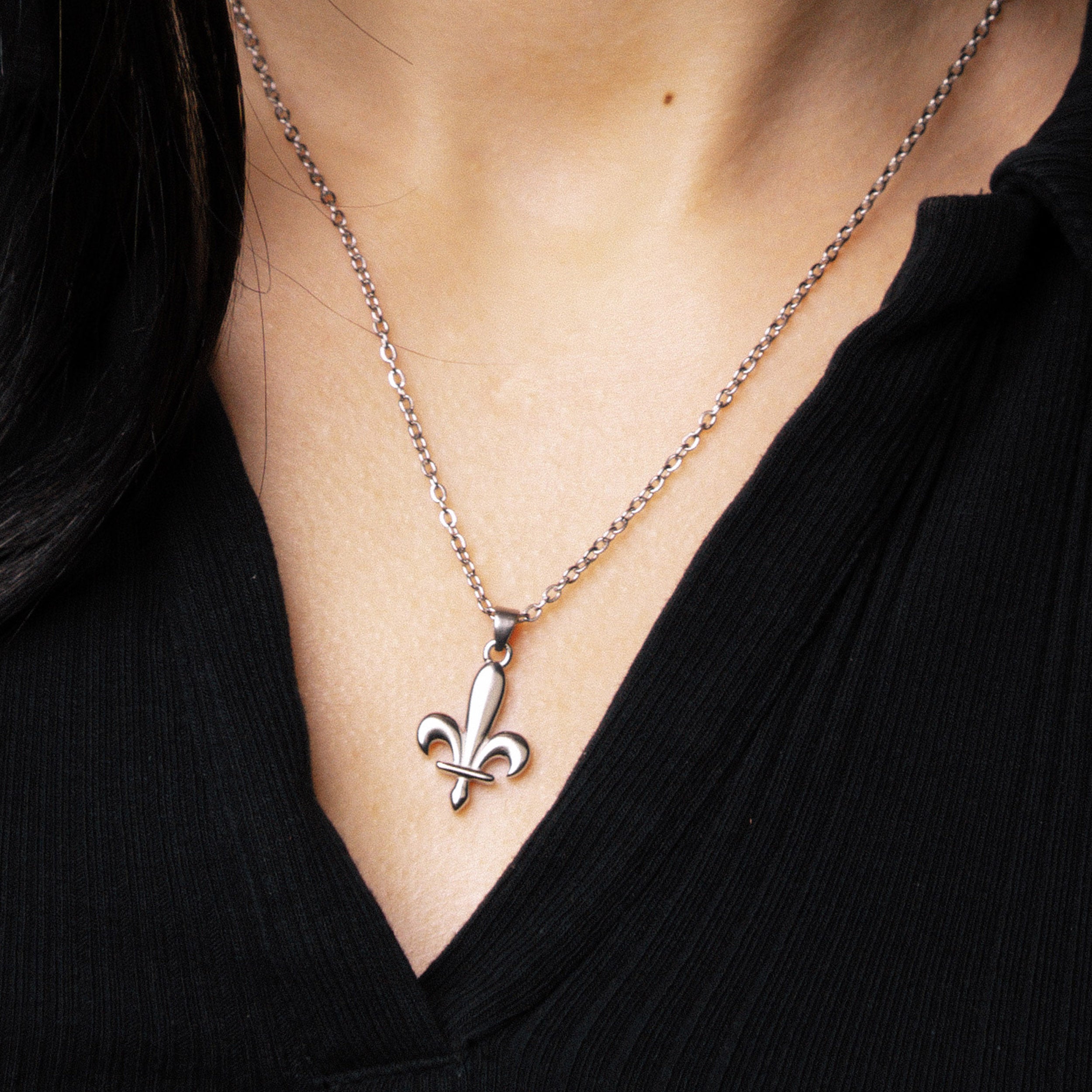 Close-up of silver Bosnia Ljiljan necklace worn by model by BLKN®