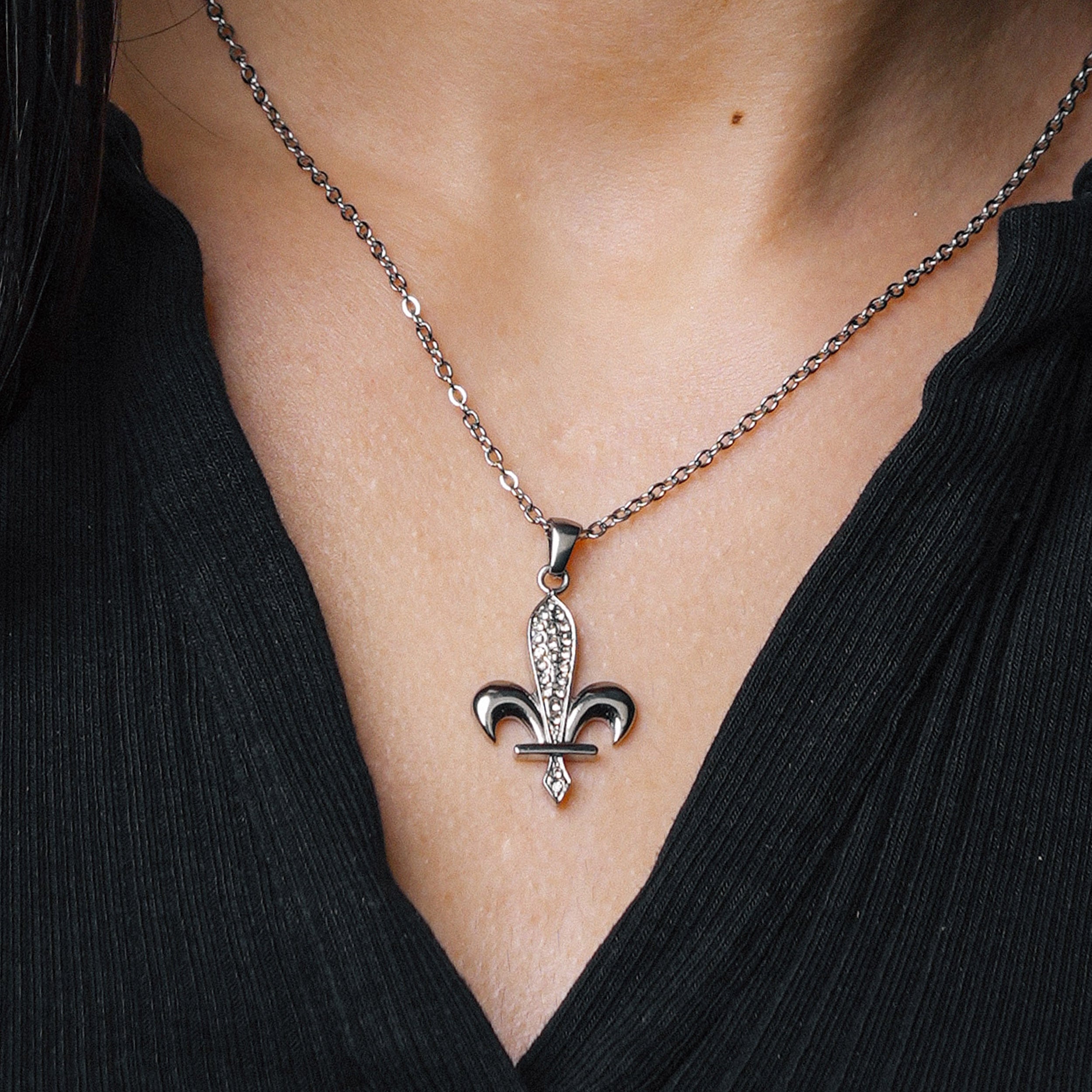 Close-up of Silver Bosnia Ljiljan Dazzling necklace with zirconia pendant worn by model by BLKN®.